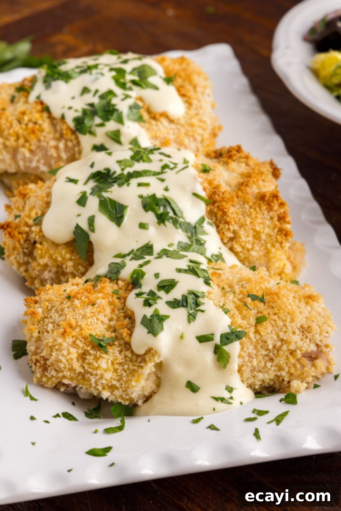 Gourmet Stuffed Chicken Rolls 3 Perfectly baked chicken cordon bleu pieces on a serving platter, showcasing the crispy exterior