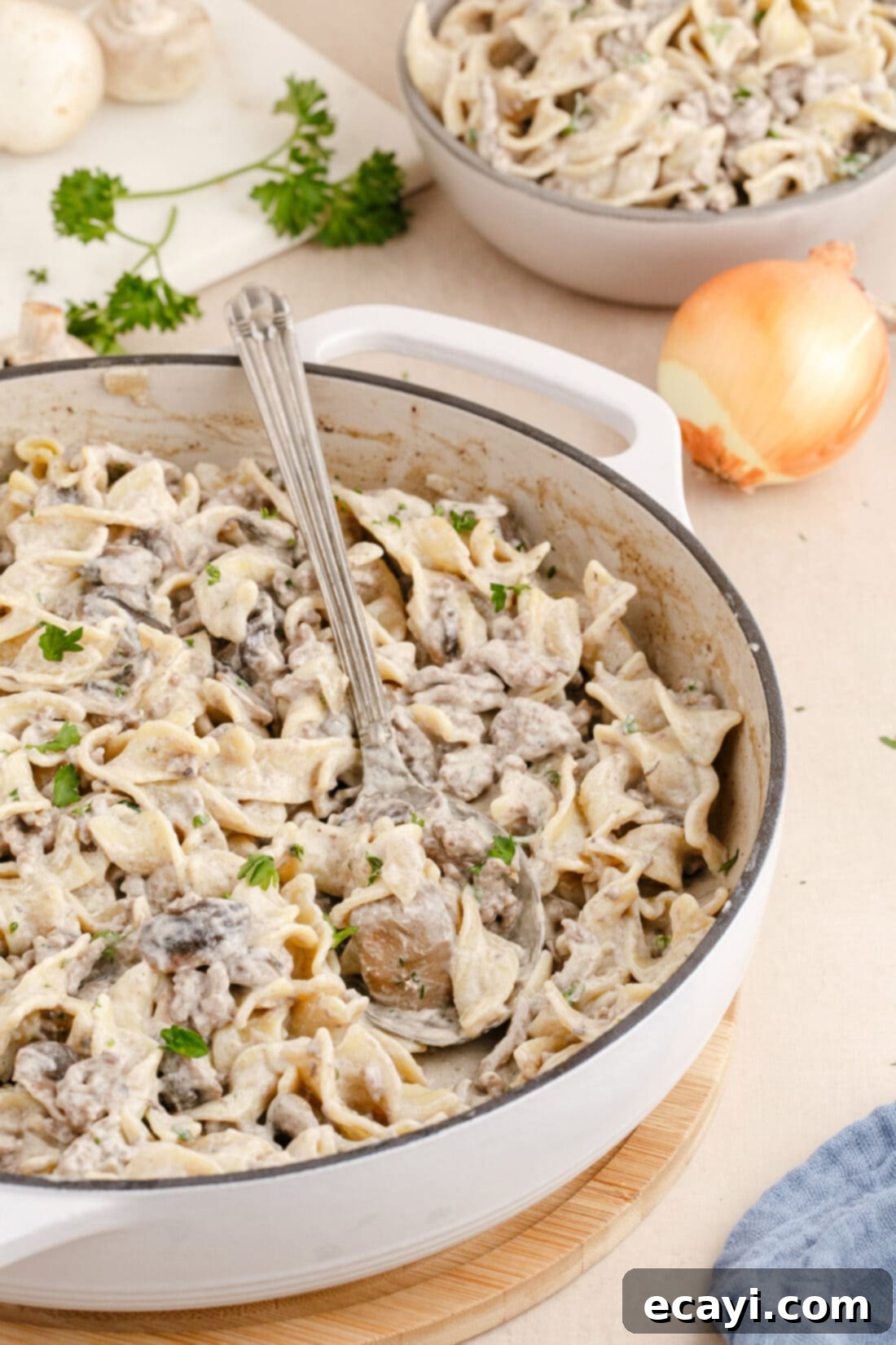 Creamy Ground Beef Stroganoff 12 Ground Beef Stroganoff served in a pan with a serving spoon, ready to be dished out.