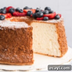 Heavenly Homemade Angel Food Cake 15 Angel Food Cake with a slice removed for serving