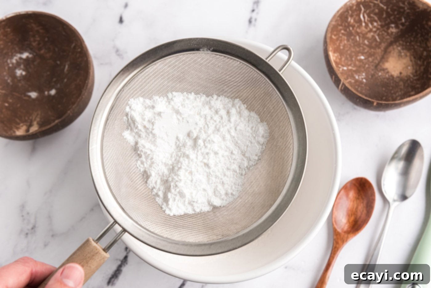 Heavenly Homemade Angel Food Cake 6 Sifting powdered sugar and flour together into a bowl