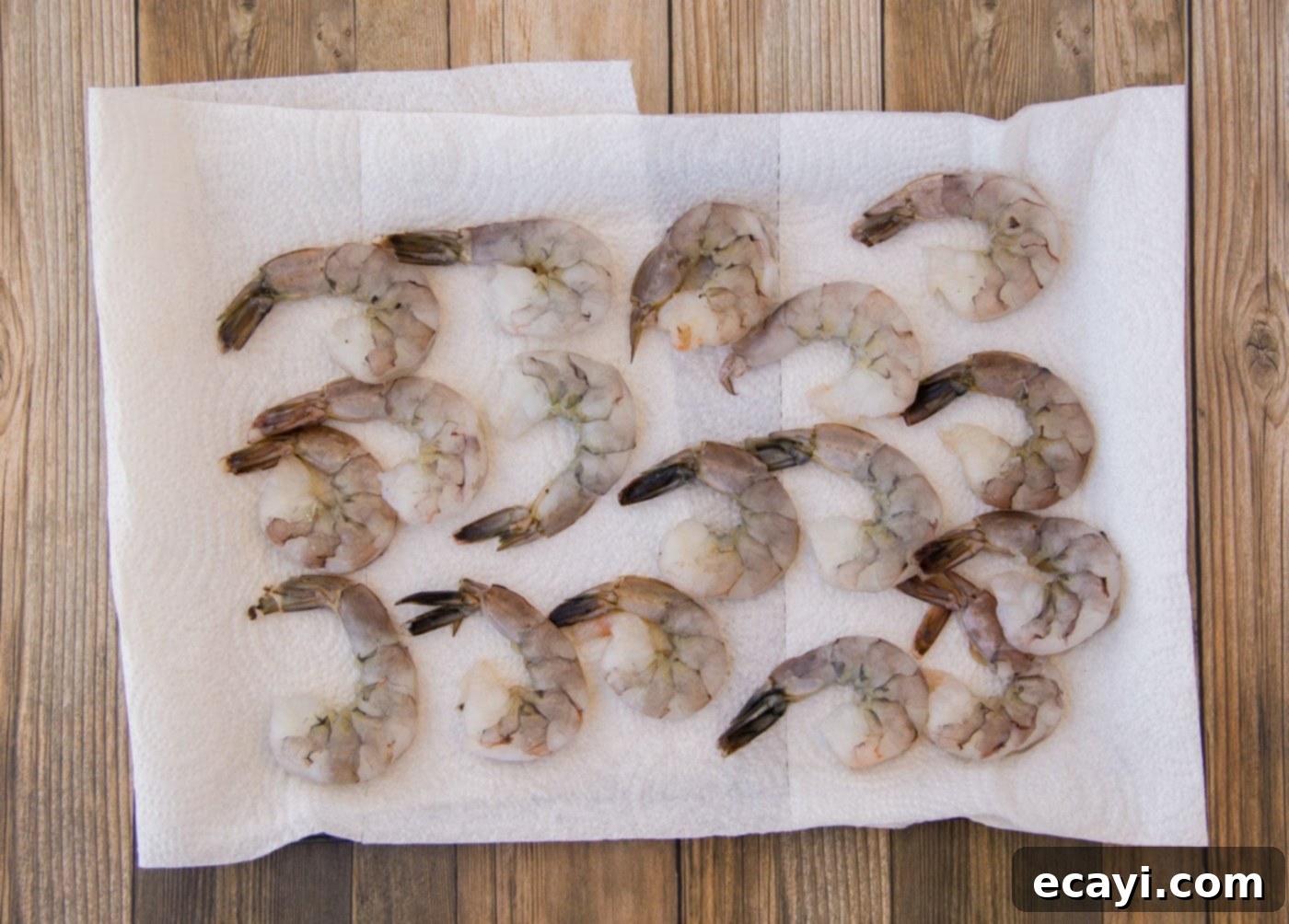 Garlic Herb Shrimp Skewers 6 raw shrimp on a paper towel