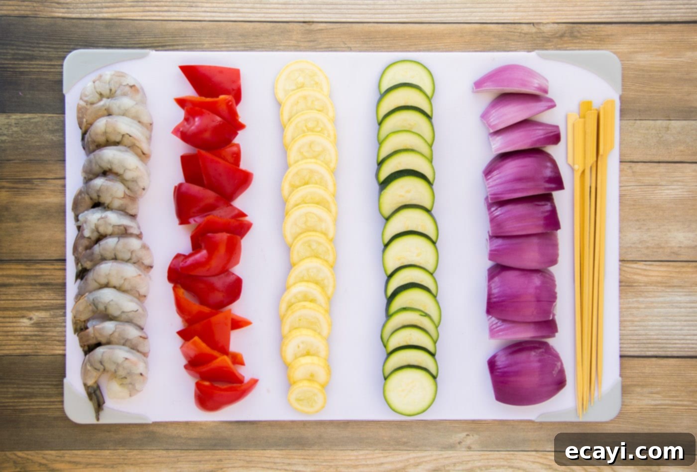 Garlic Herb Shrimp Skewers 8 sliced veggies on a cutting board