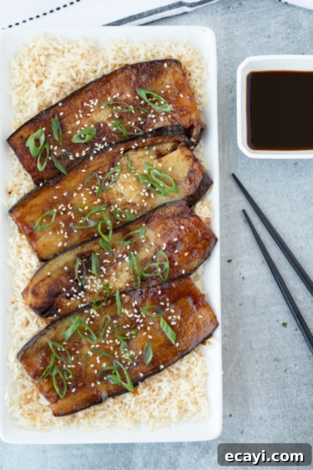 Sticky Soy Glazed Eggplant 2 Soy Glazed Eggplant with chopsticks