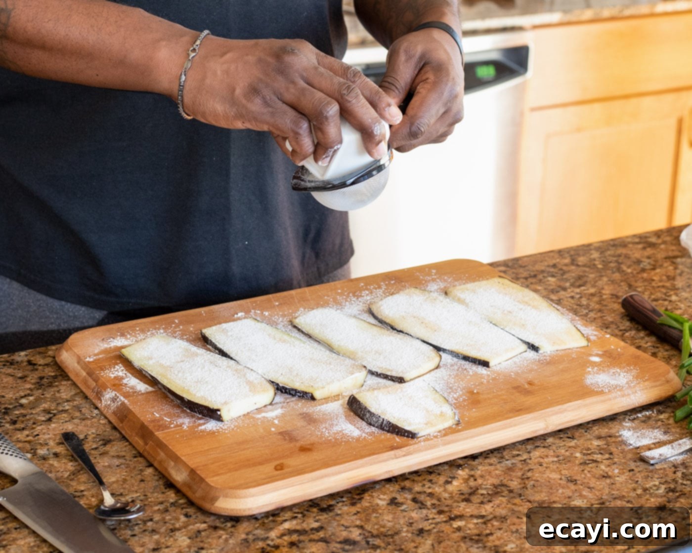 Sticky Soy Glazed Eggplant 5 sifting cornstarch over slices of eggplant