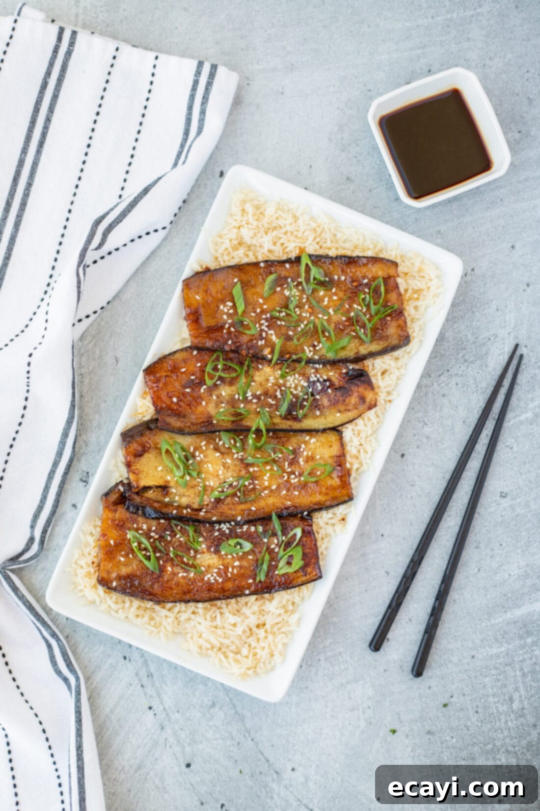Sticky Soy Glazed Eggplant 8 Soy Glazed Eggplant over rice on a plattter