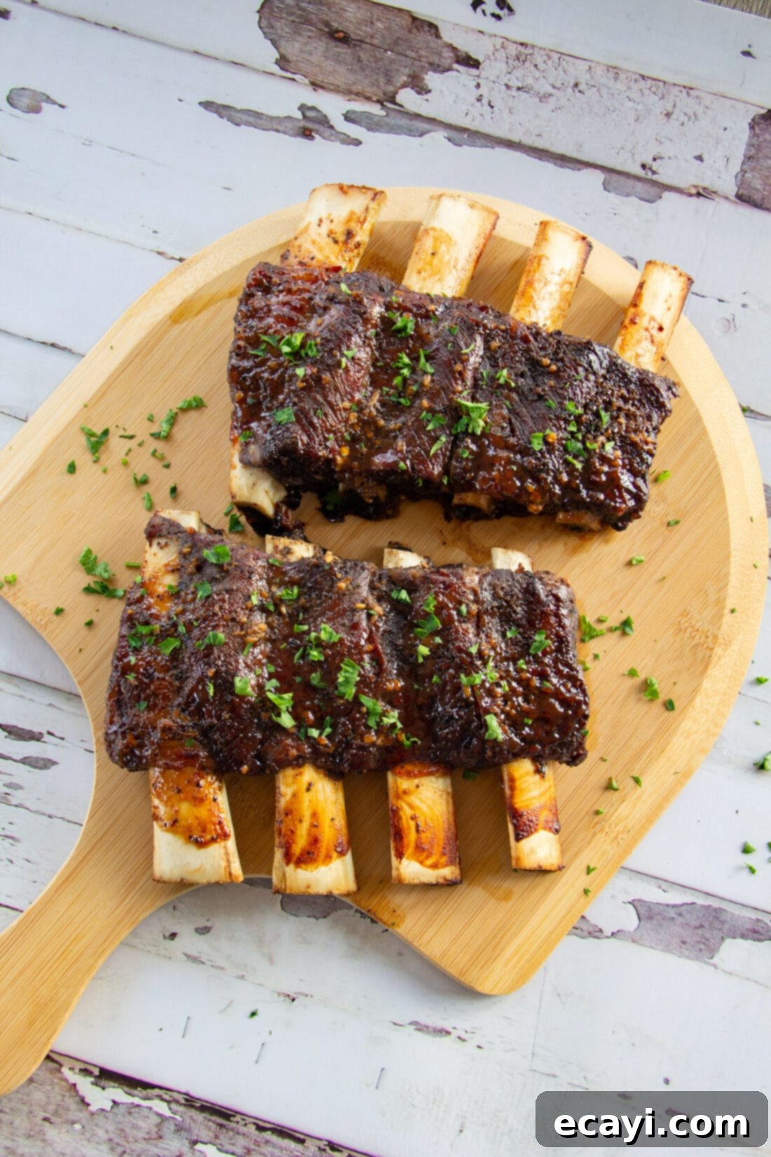 Fall-Off-The-Bone Beef Ribs 2 Beef Ribs made in the oven on a wood baord