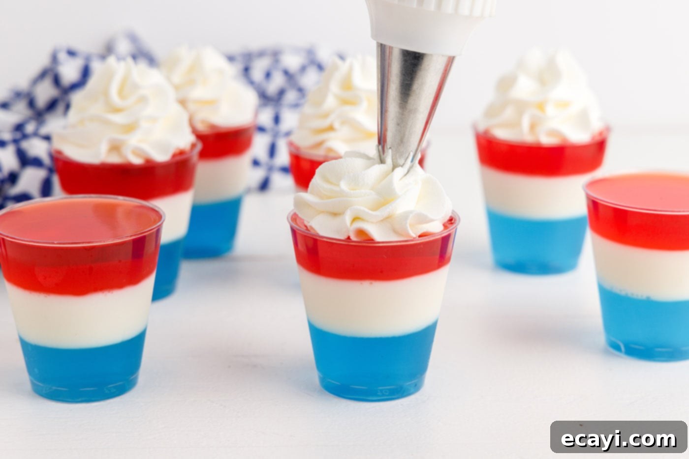 Star-Spangled Gelatin Shots 12 whipped cream on top of 4th of july jello shots