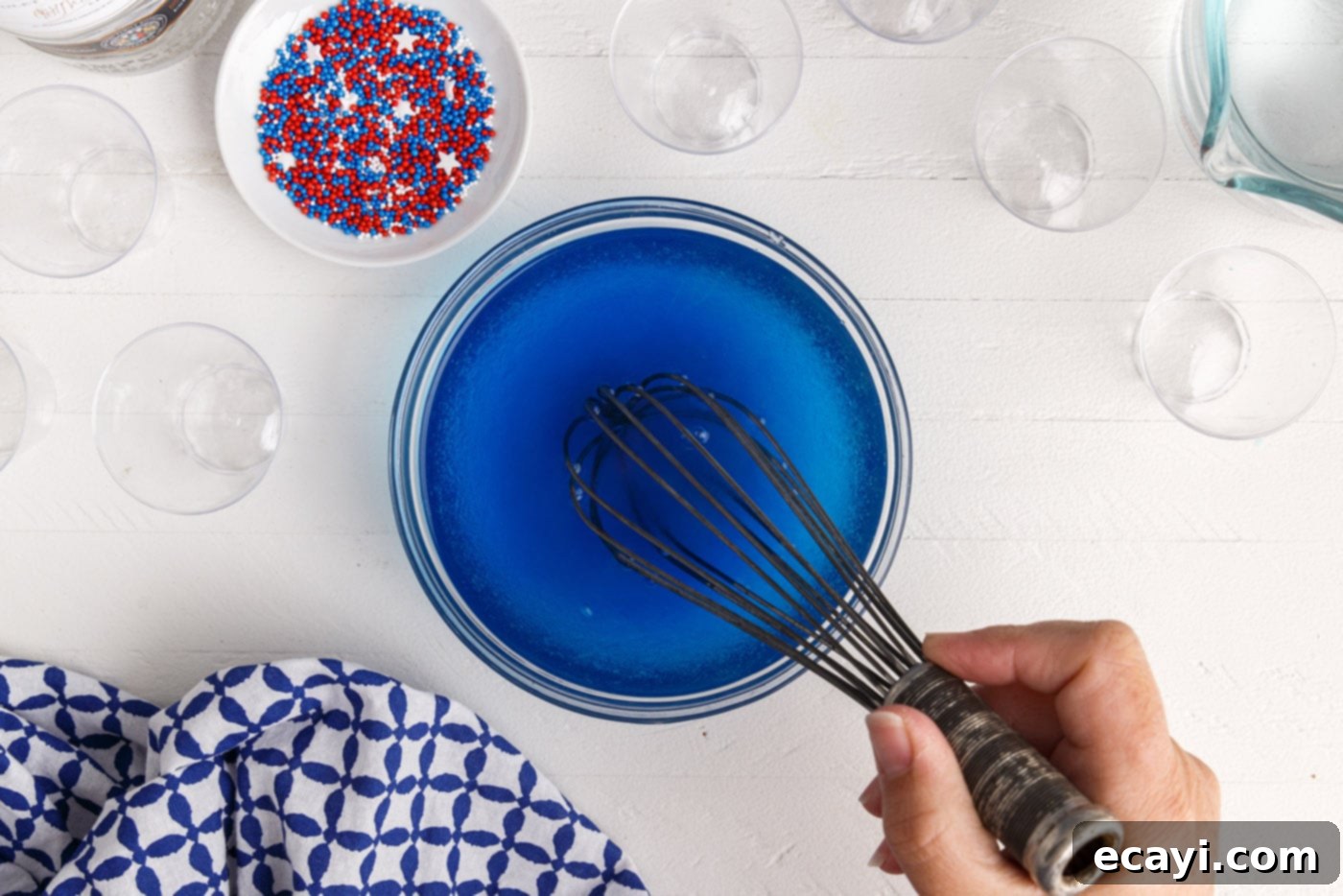 Star-Spangled Gelatin Shots 5 whisking blue jello with water