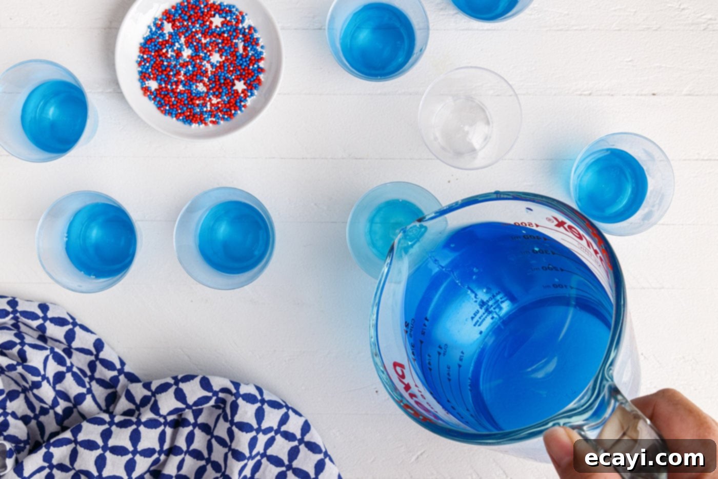 Star-Spangled Gelatin Shots 7 pouring jello into a shot glass