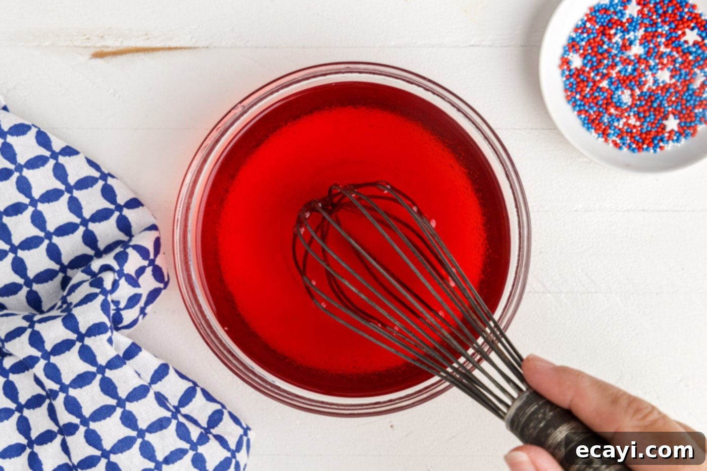 Star-Spangled Gelatin Shots 10 whisking red jello with water