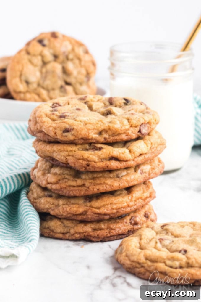 Big Soft Chocolate Chip Cookies AmandasCookin.com stack of chocolate chip cookies wit ha glass of milk