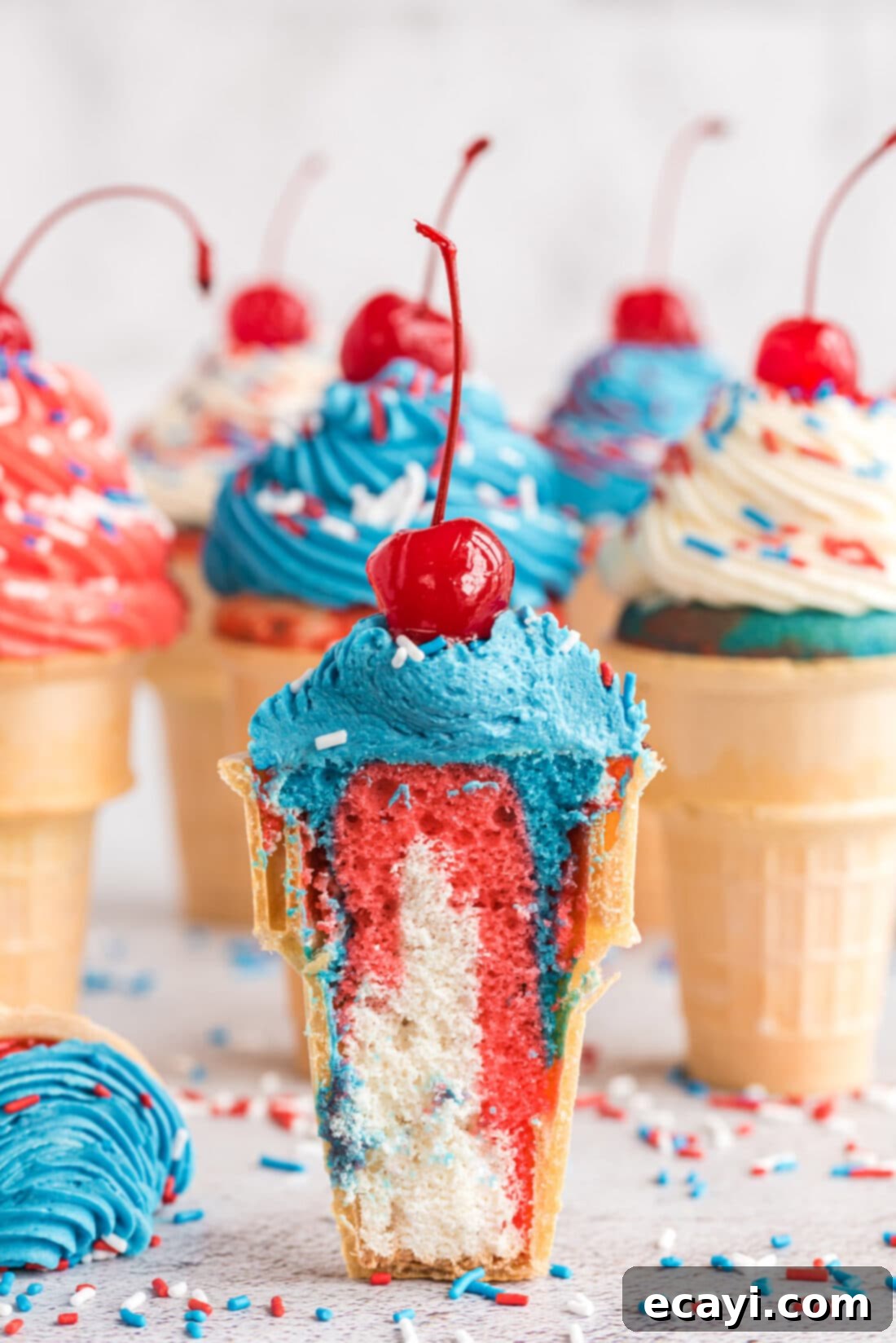 Patriotic Cone Cupcakes 2 Patriotic Ice Cream Cone Cupcakes cut in half, revealing colorful layers