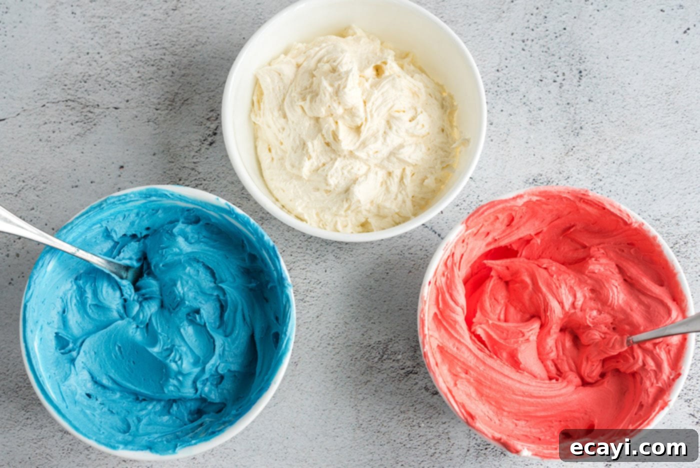 Patriotic Cone Cupcakes 11 Bowls of red, white, and blue buttercream frosting