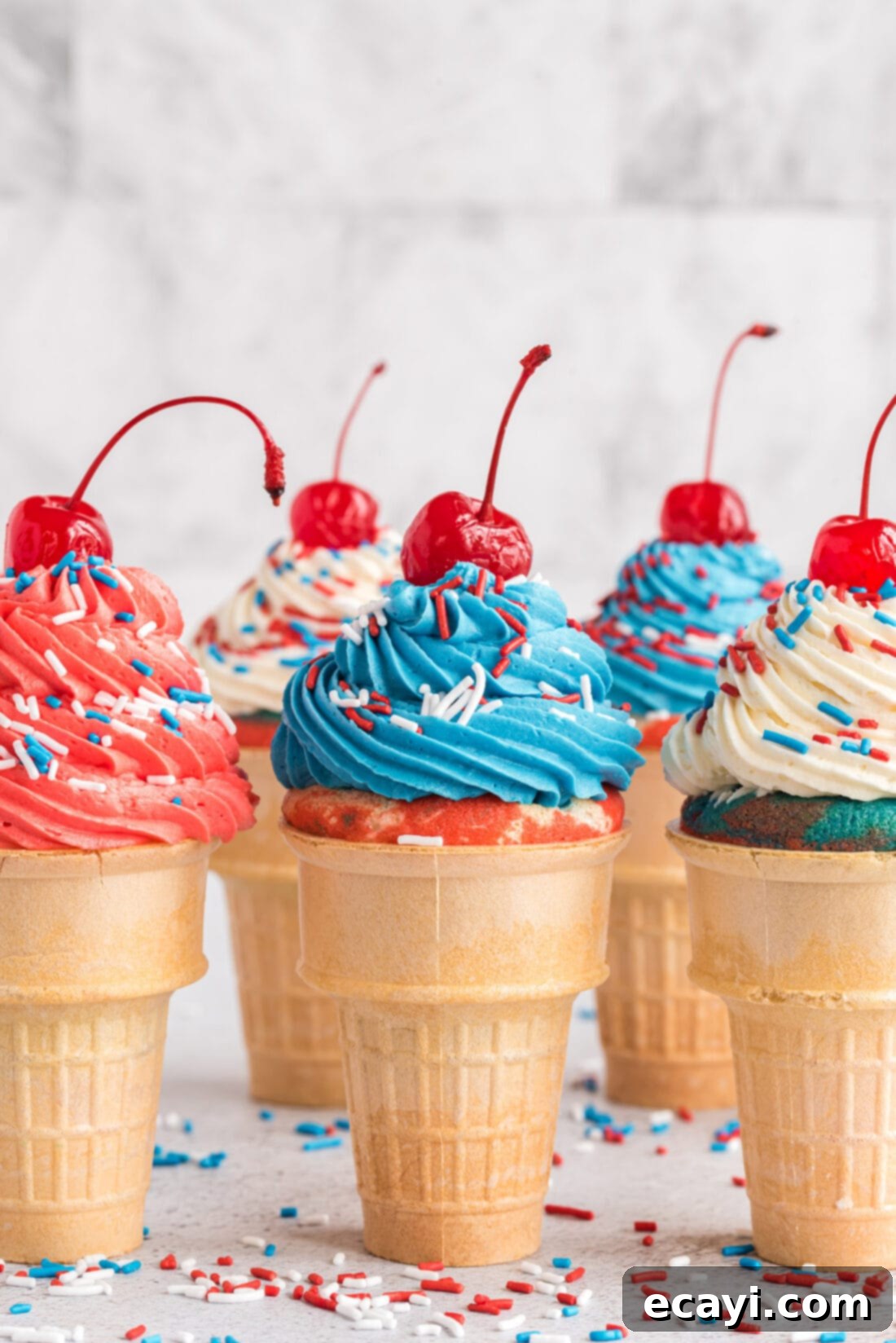Patriotic Cone Cupcakes 3 Patriotic Ice Cream Cone Cupcakes topped with cherries and sprinkles