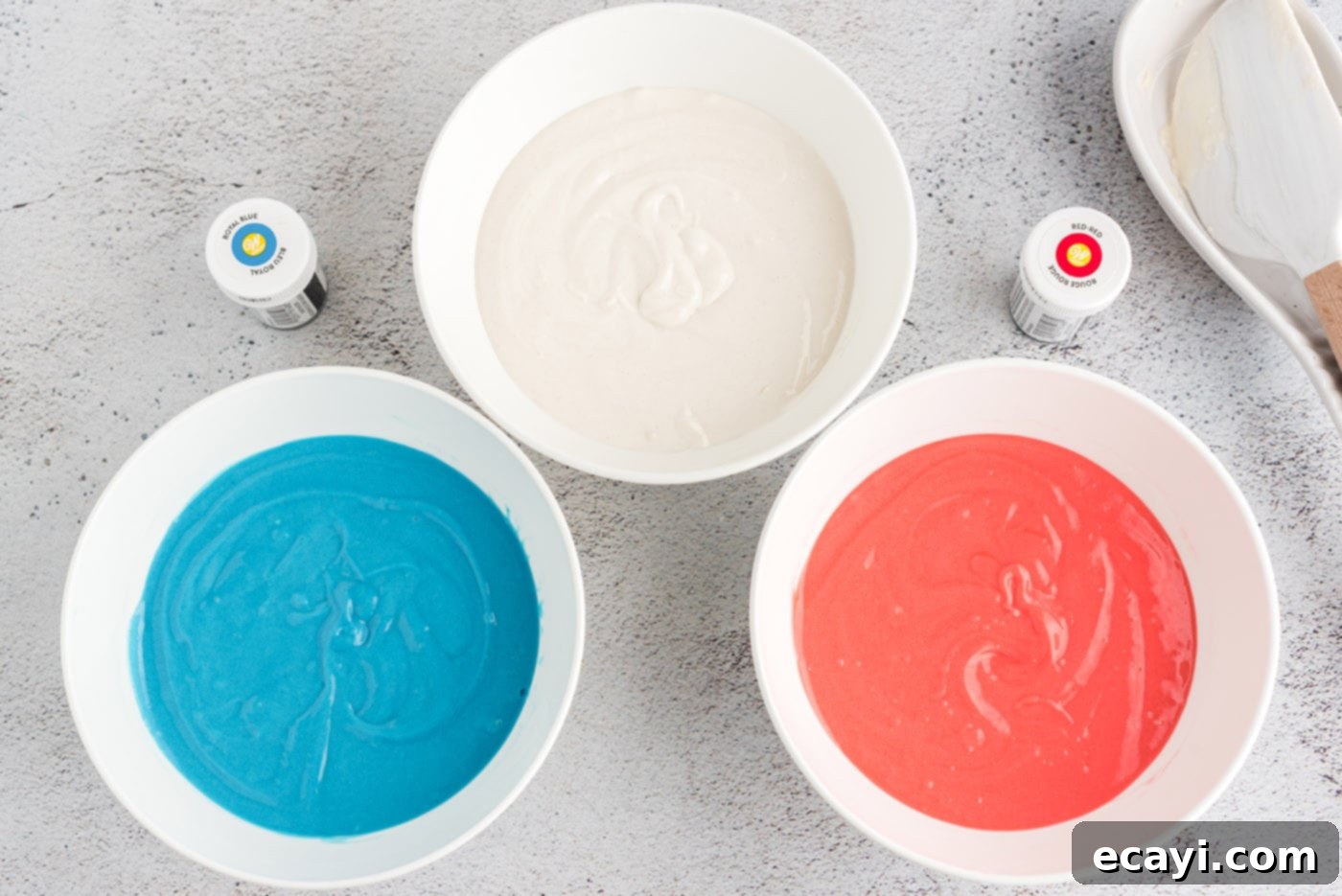 Patriotic Cone Cupcakes 5 Three bowls of cake batter: one red, one white, and one blue