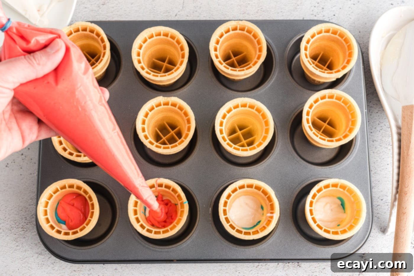 Patriotic Cone Cupcakes 7 Piping red cake batter inside an ice cream cone