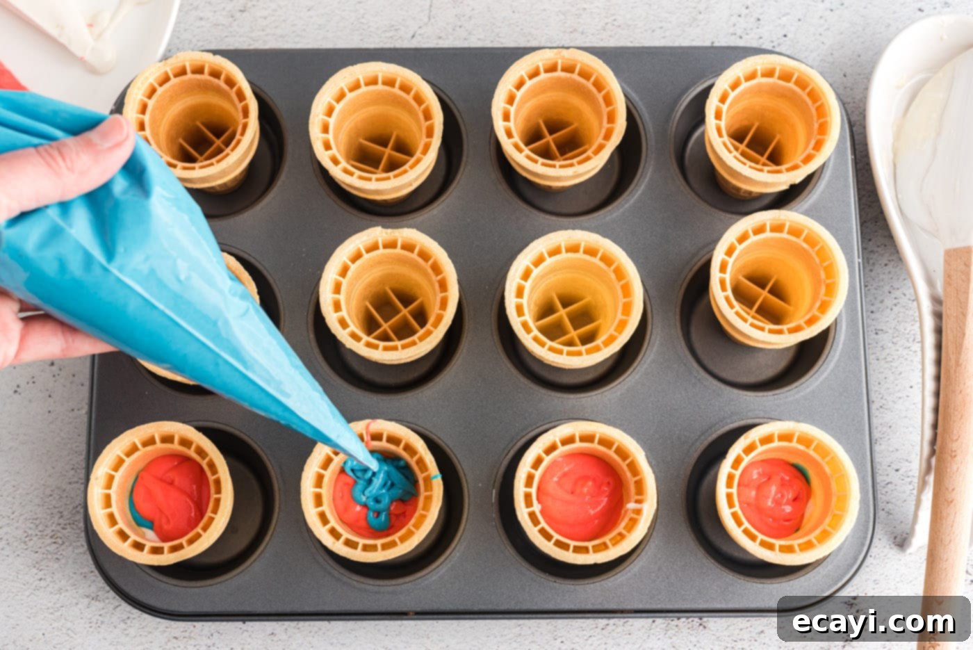 Patriotic Cone Cupcakes 8 Piping blue cake batter inside an ice cream cone