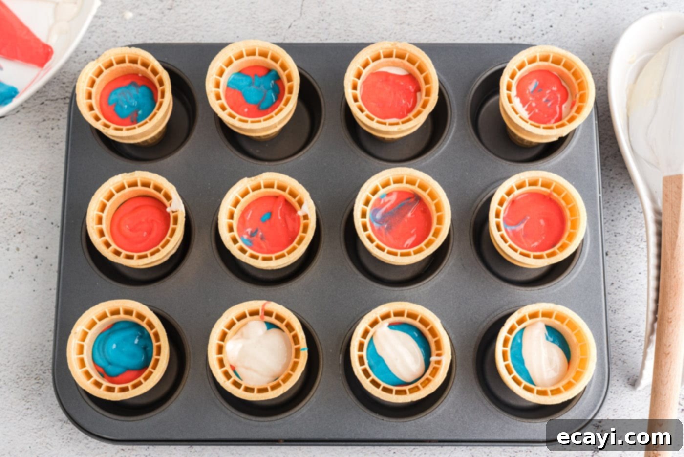 Patriotic Cone Cupcakes 9 Patriotic ice cream cone cupcakes ready for baking in a cupcake pan