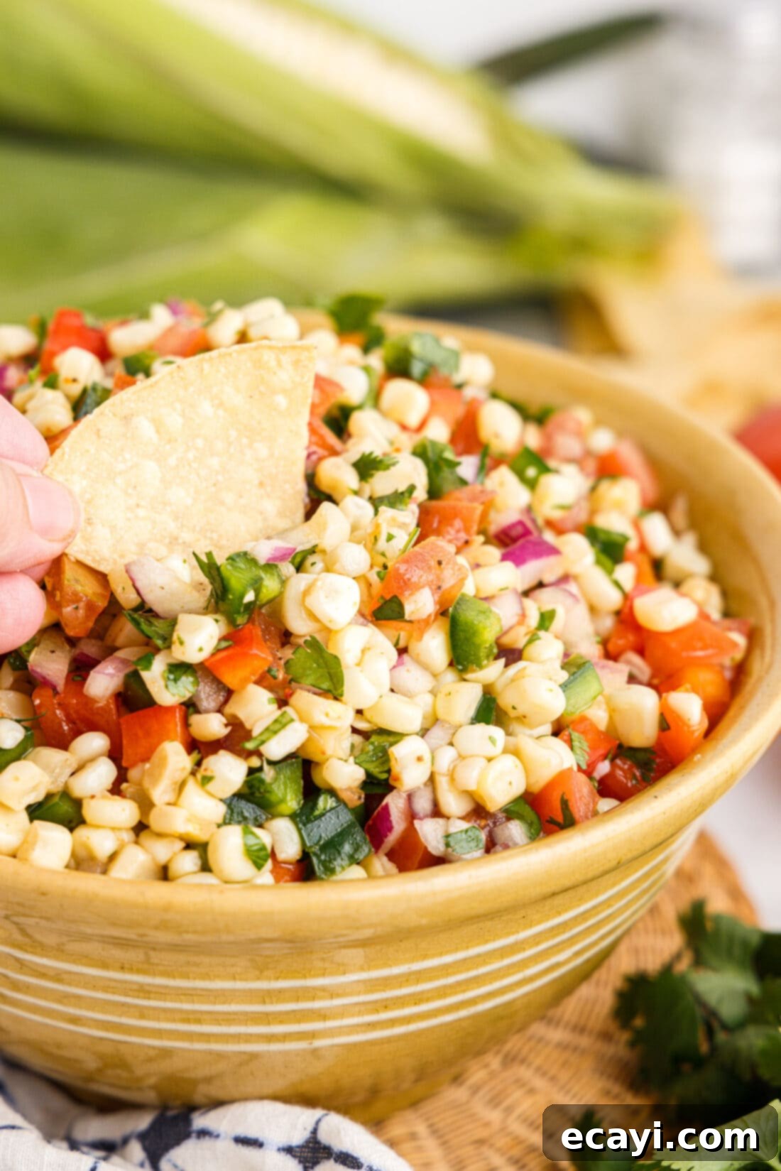 Zesty Corn Medley 2 dipping chip in Corn Salsa
