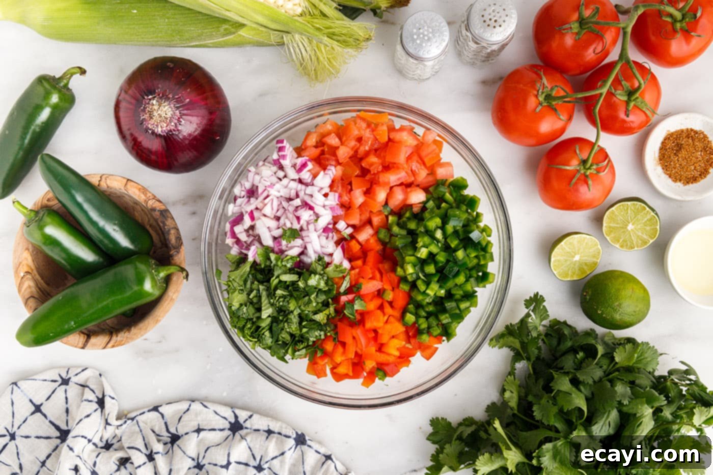 Zesty Corn Medley 5 corn, tomatoes, onion, cilantro, and bell peppers in a bowl
