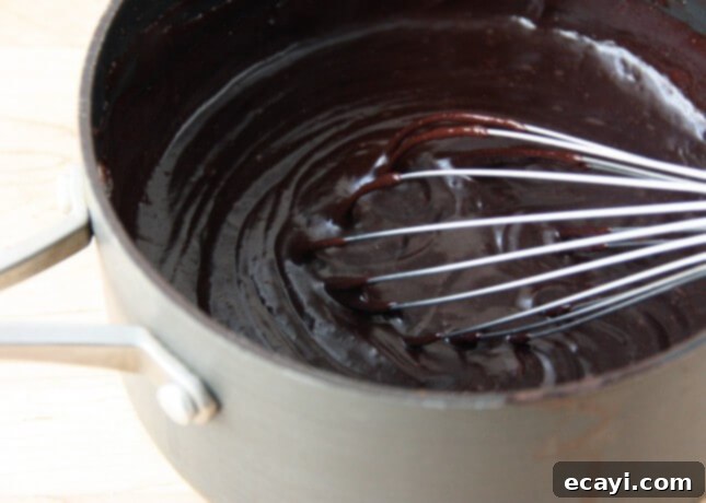 Chocolate Eclairs A Visual Step by Step Guide 14 Smooth, glossy Chocolate Pastry Cream ready for chilling // FoodNouveau.com