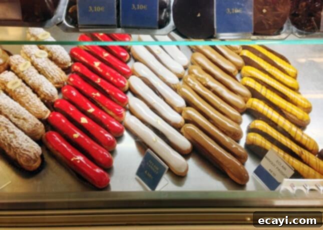 Chocolate Eclairs A Visual Step by Step Guide 6 Stohrer's elegant éclair display in Paris, showcasing classic French pastries // FoodNouveau.com