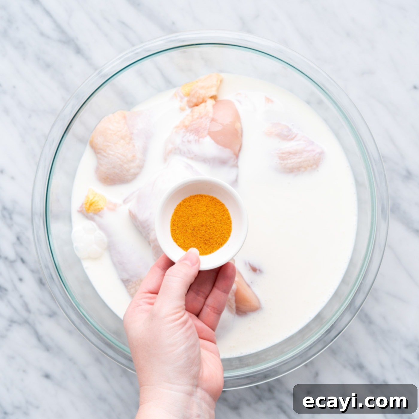 Crispy Air Fryer Chicken 6 buttermilk and seasoning in a bowl of chicken