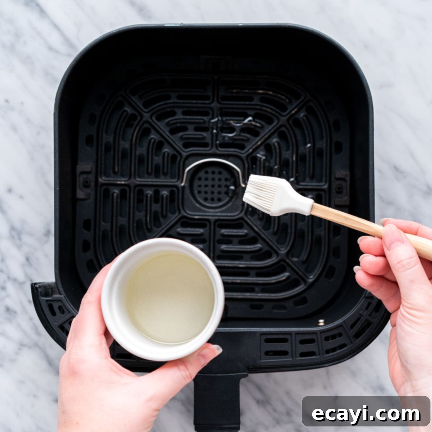Crispy Air Fryer Chicken 9 brushing air fryer with oil