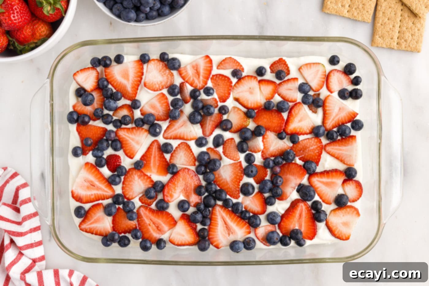 Berry Burst Chill Cake 13 layer of strawberries and blueberries over cream cheese pudding mixture