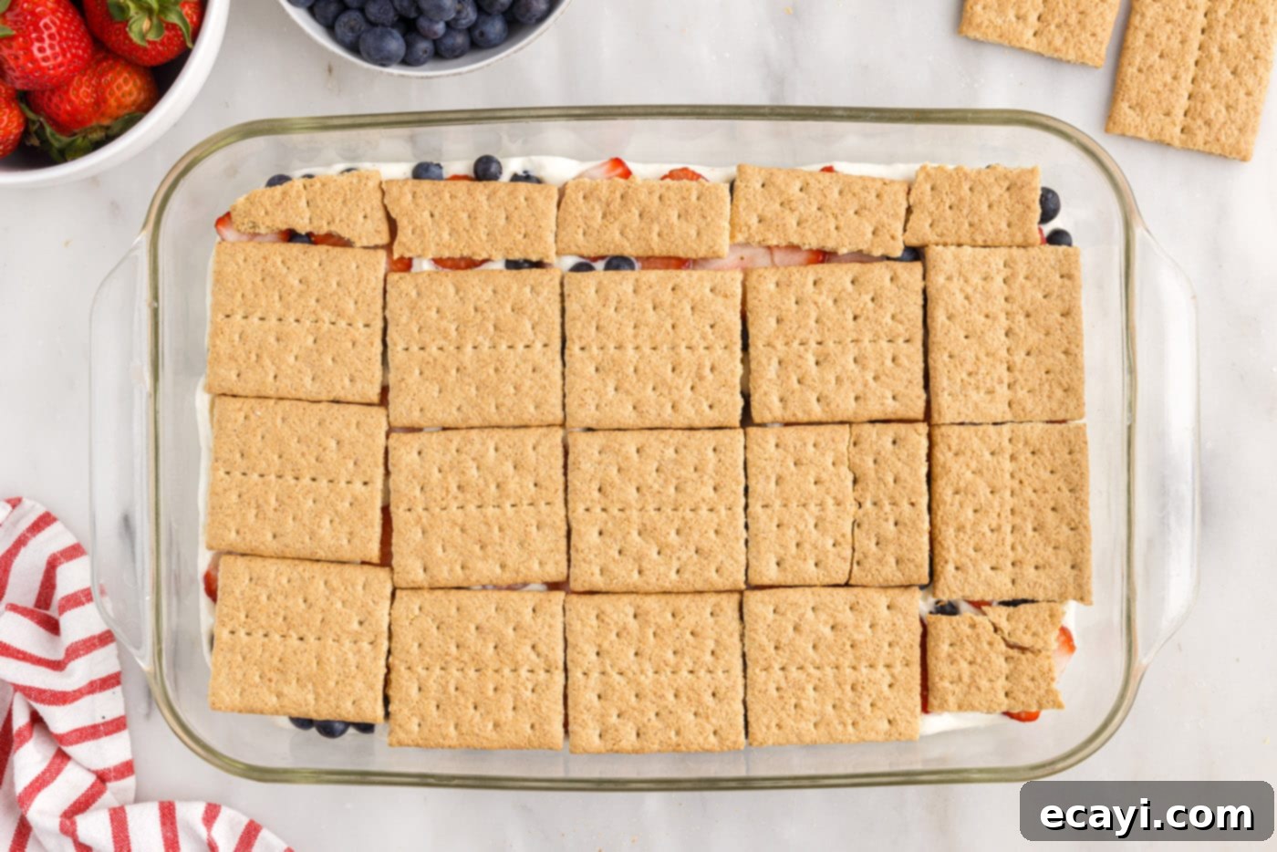 Berry Burst Chill Cake 14 graham crackers layered over berries in a baking dish