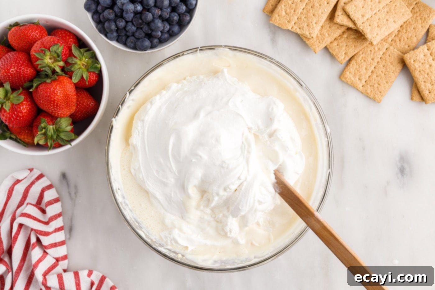 Berry Burst Chill Cake 8 folding cool whip into pudding mixture