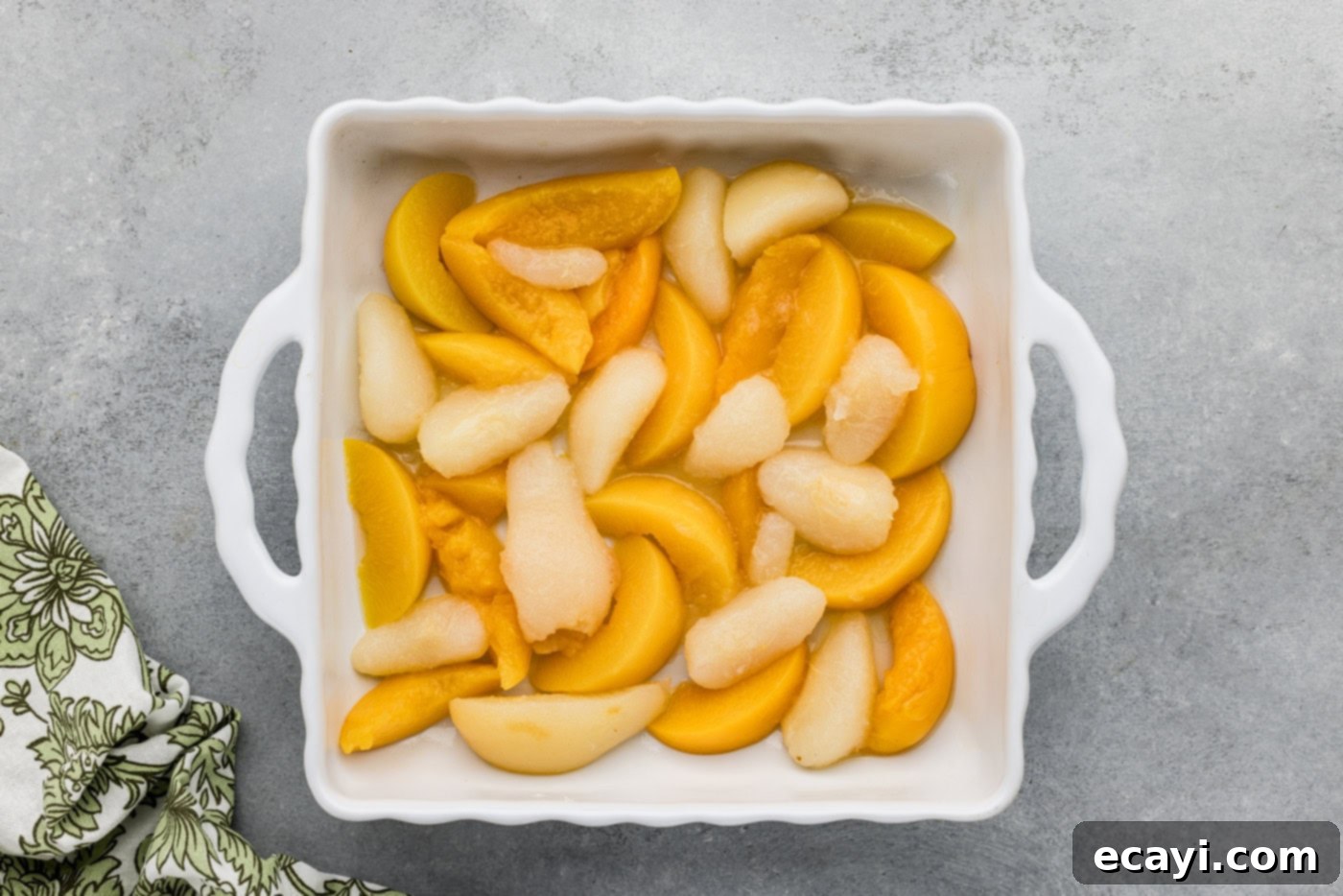 Golden Pear Peach Cobbler 5 drained canned peaches and pears in a baking dish