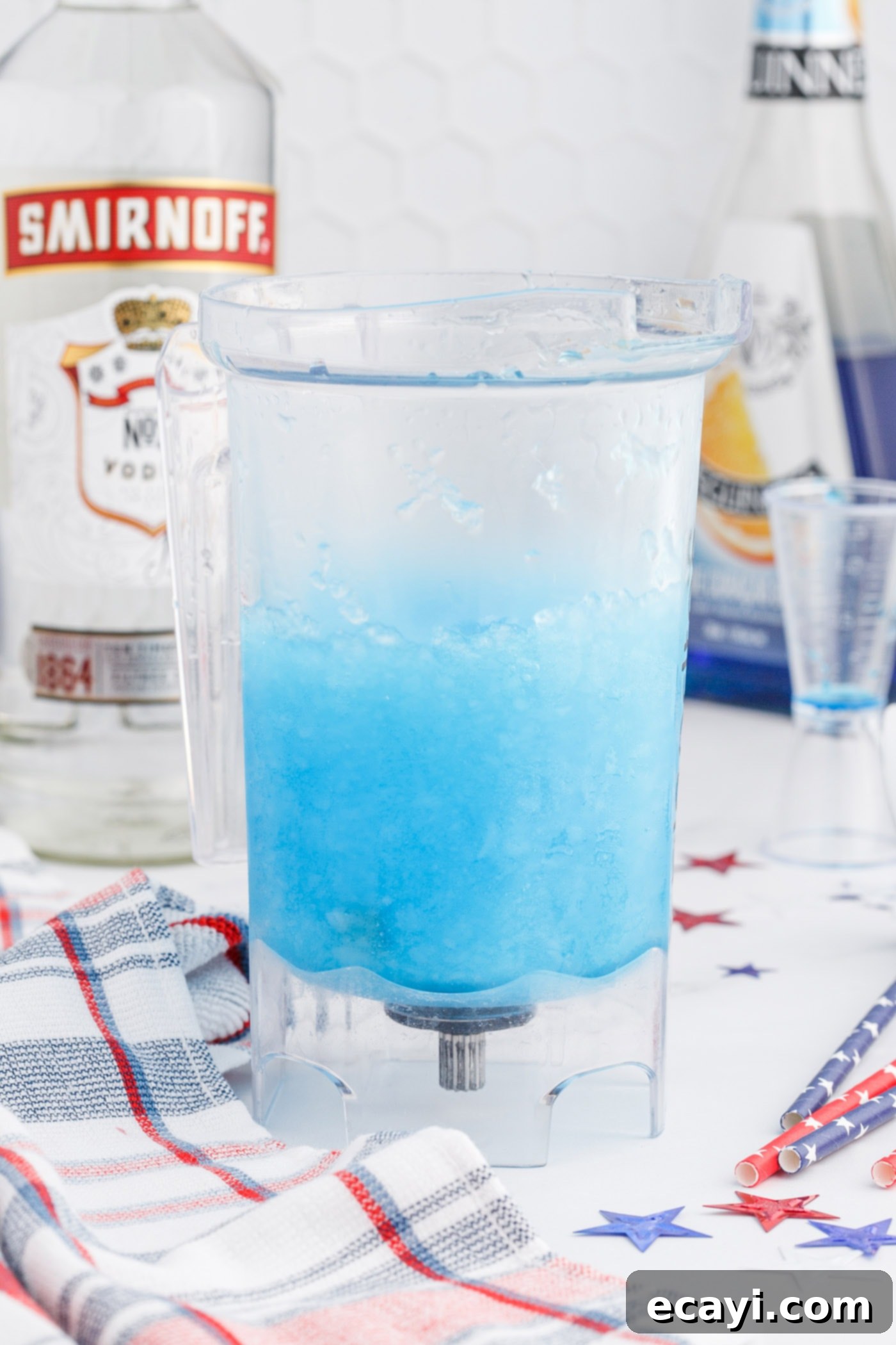 Red White & Boozy Freeze 8 The blue layer, made with blue curacao and lemonade, being blended with ice in a blender to a brilliant blue slush.