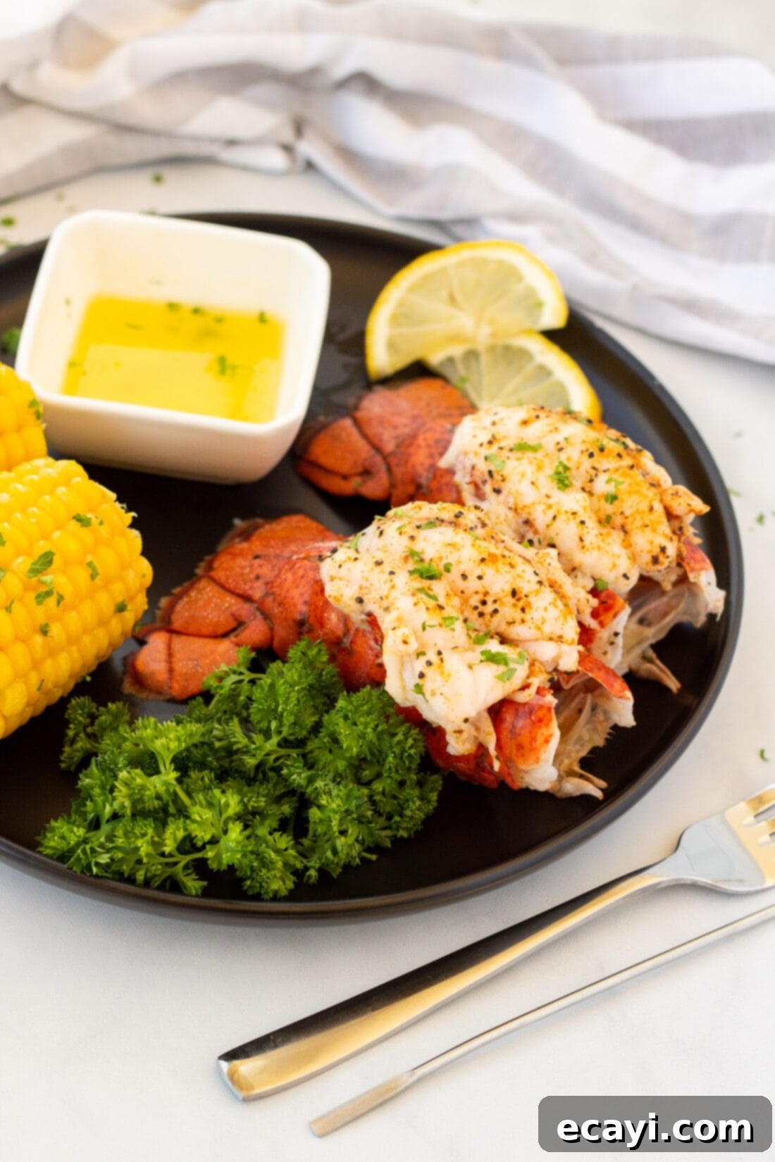 Succulent Steamed Lobster Tail 3 Two perfectly steamed lobster tails, crowned and ready to serve, glistening with melted butter.
