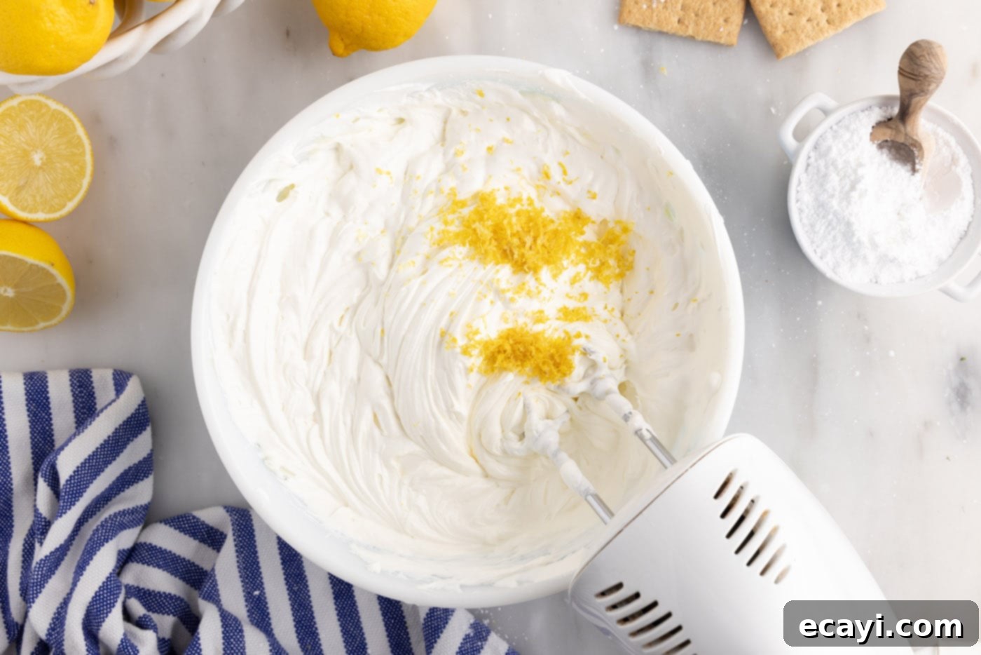 Golden Lemon Indulgence 11 Adding fresh lemon zest to the creamy cream cheese mixture.