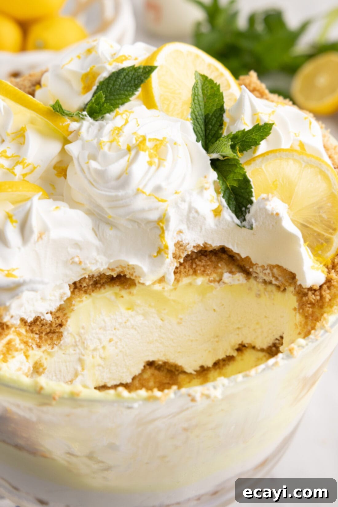 Golden Lemon Indulgence 16 A serving of Lemon Lush Trifle with a spoon, showing the creamy, layered texture.