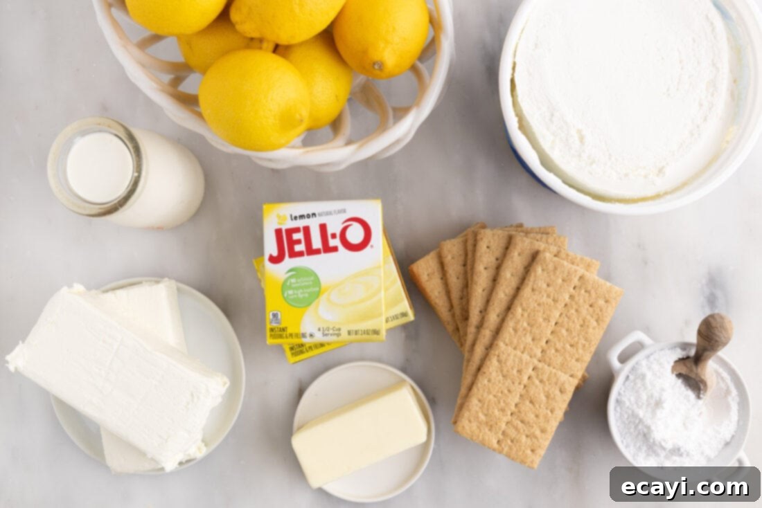 Golden Lemon Indulgence 4 All ingredients laid out for making Lemon Lush Trifle: graham crackers, butter, pudding mix, milk, Cool Whip, cream cheese, powdered sugar, lemon zest, and lemon slices.