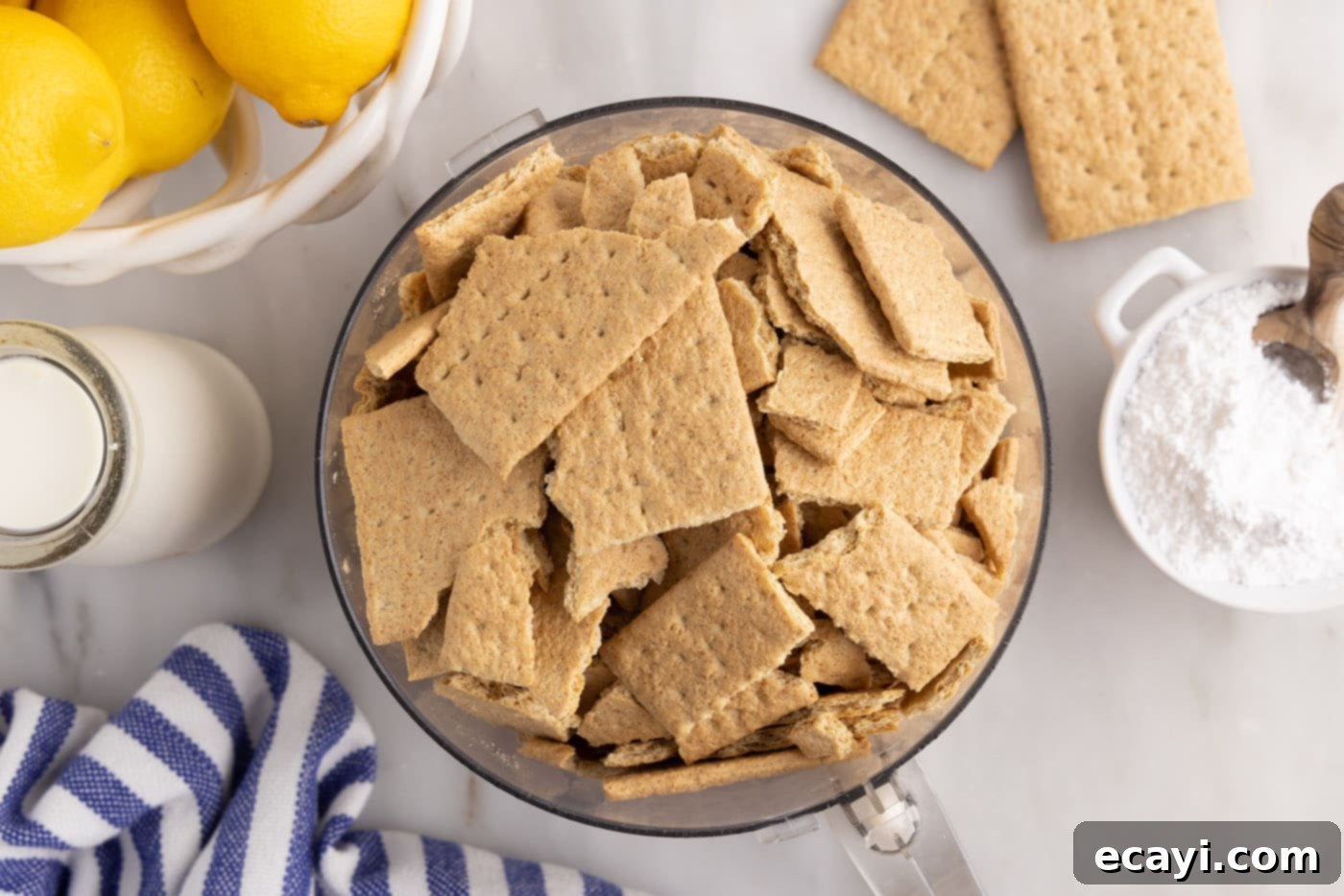 Golden Lemon Indulgence 5 Graham crackers being pulsed into fine crumbs in a food processor.