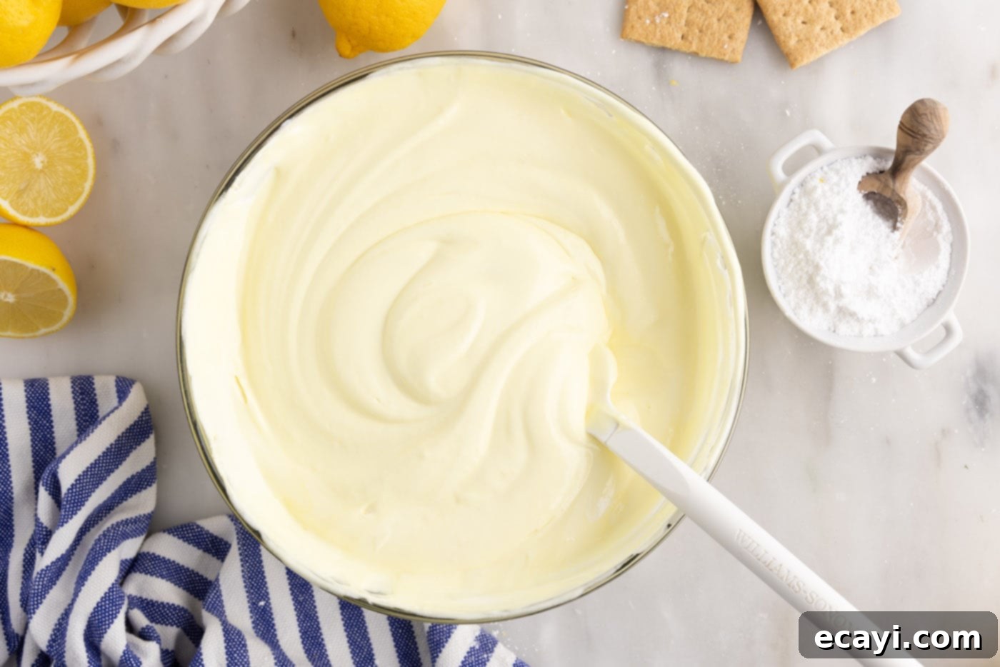 Golden Lemon Indulgence 9 Smooth, whipped lemon pudding mixture in a bowl, ready for layering.