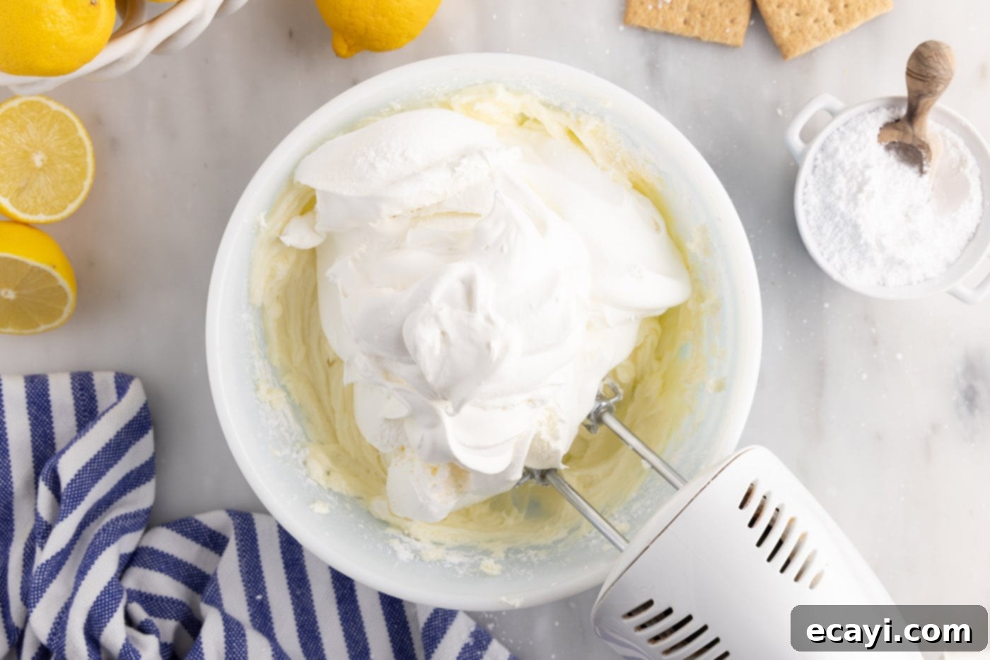 Golden Lemon Indulgence 10 Beating Cool Whip into the cream cheese mixture until light and fluffy.