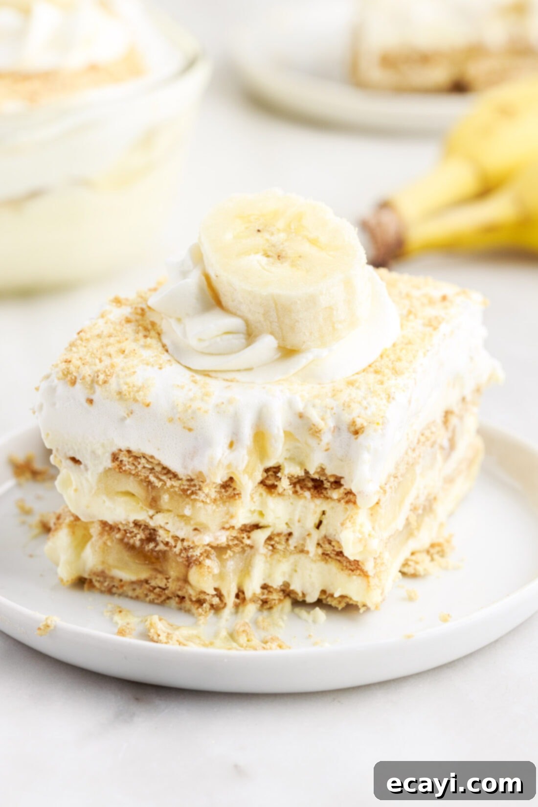 No-Bake Banana Cream Delight 2 Banana Cream Pie Icebox Cake with a forkful removed