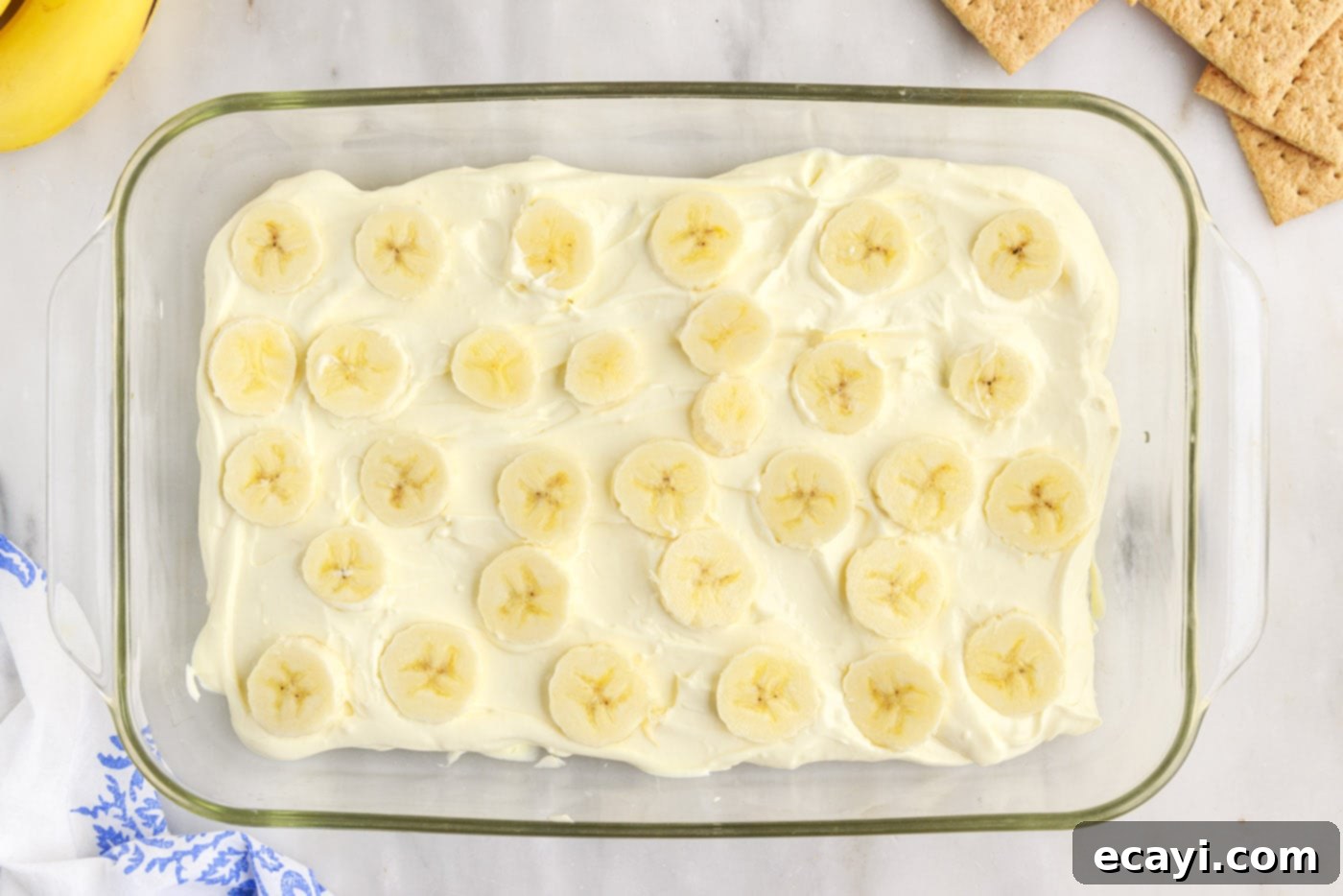 No-Bake Banana Cream Delight 12 banana slices on top of banana cream pudding