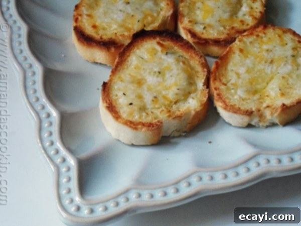 Homemade Garlic Cheese Spread - AmandasCookin.com Toasted baguette slices with 7 Cheese Garlic Spread