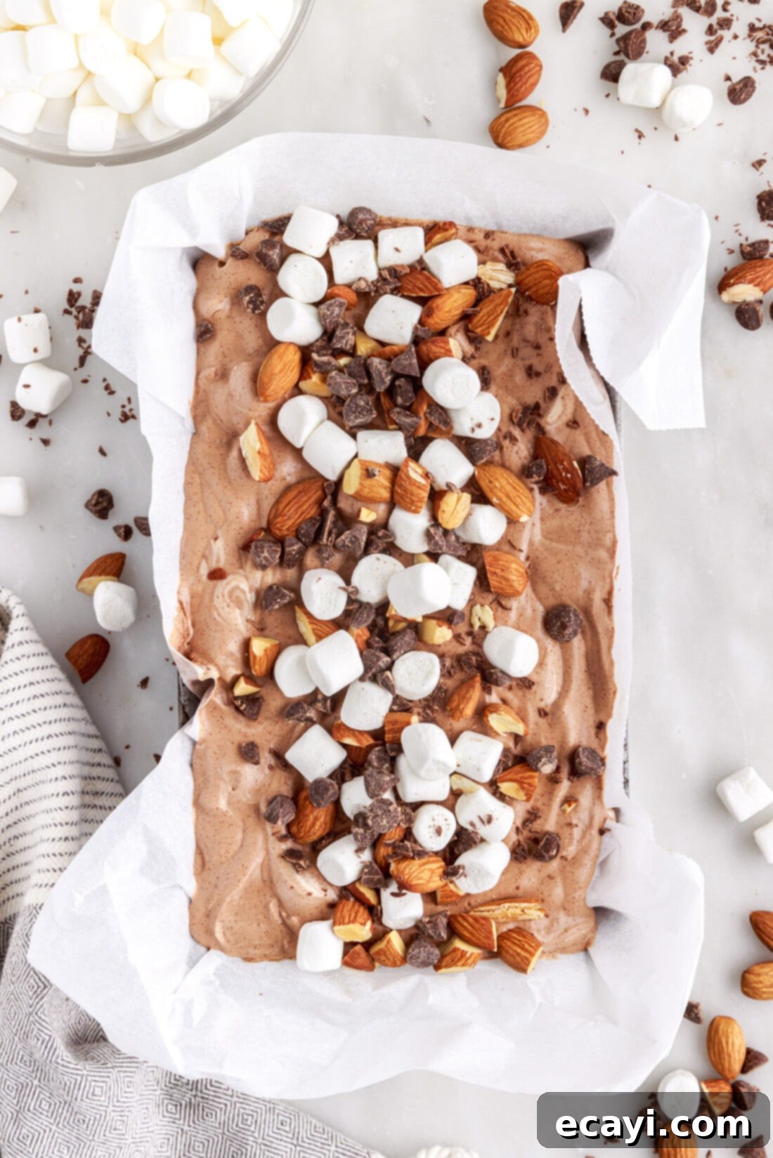 The Ultimate Rocky Road 13 pan of Rocky Road Ice Cream with marshmallows and nuts on top, ready to be scooped