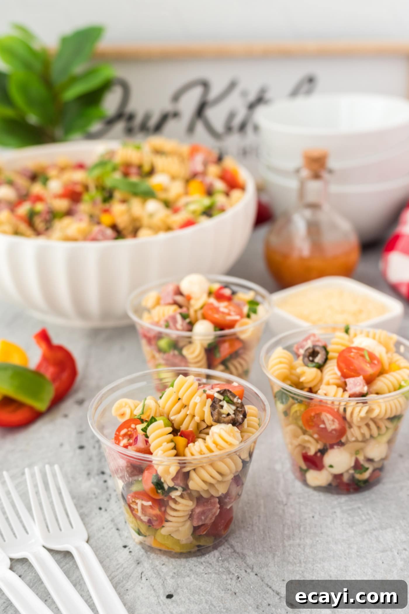 Zesty Italian Pasta Salad 8 Individual servings of Italian Pasta Salad in small clear cups, ready for a party.