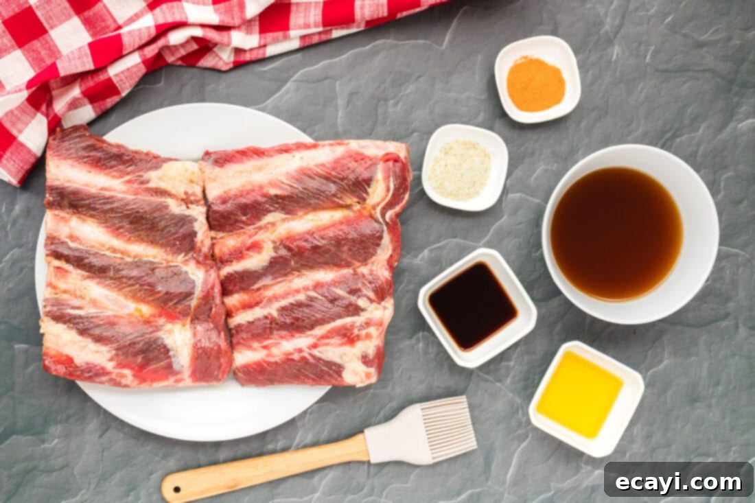 Effortless Instant Pot Beef Ribs 4 A selection of ingredients laid out for making Instant Pot Beef Ribs, including riblets, seasonings, and barbecue sauce.
