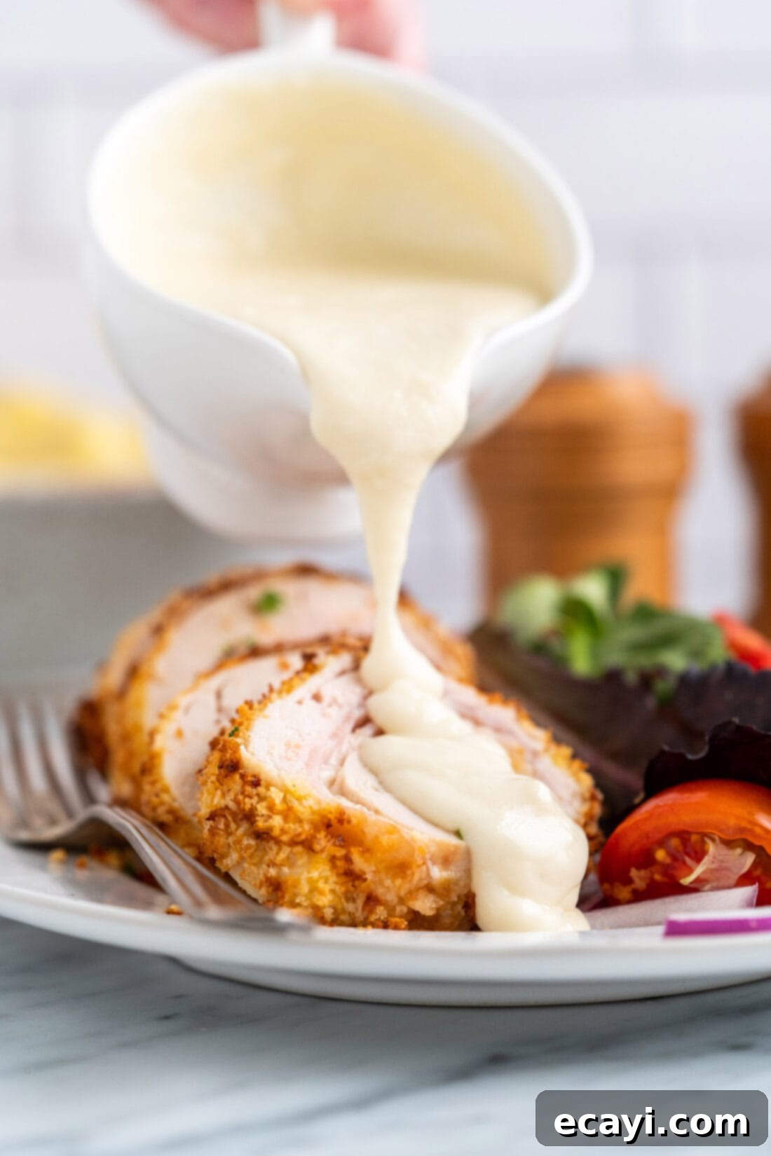 Crispy Air Fryer Chicken Cordon Bleu 2 Air fryer chicken cordon bleu drizzled with creamy dijon sauce, ready to serve