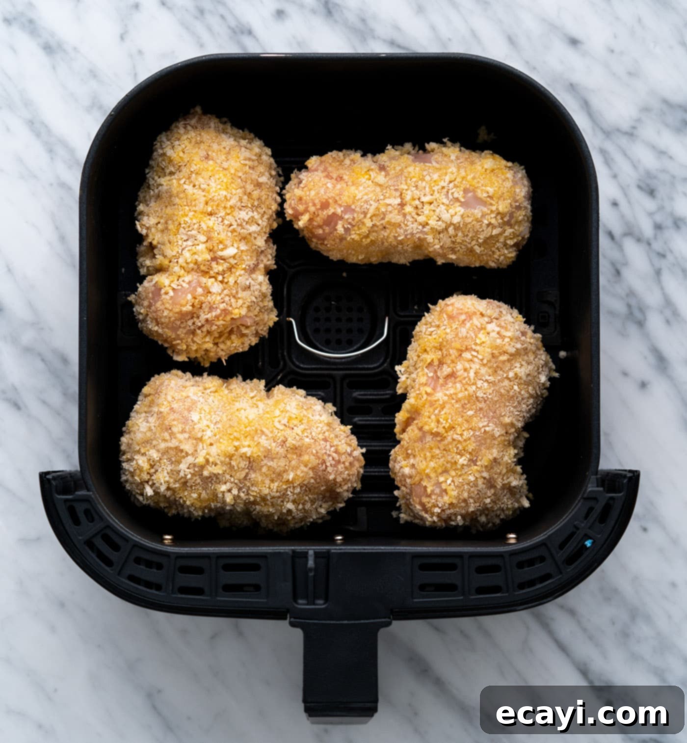 Crispy Air Fryer Chicken Cordon Bleu 14 Chicken cordon bleu cooking in the air fryer basket