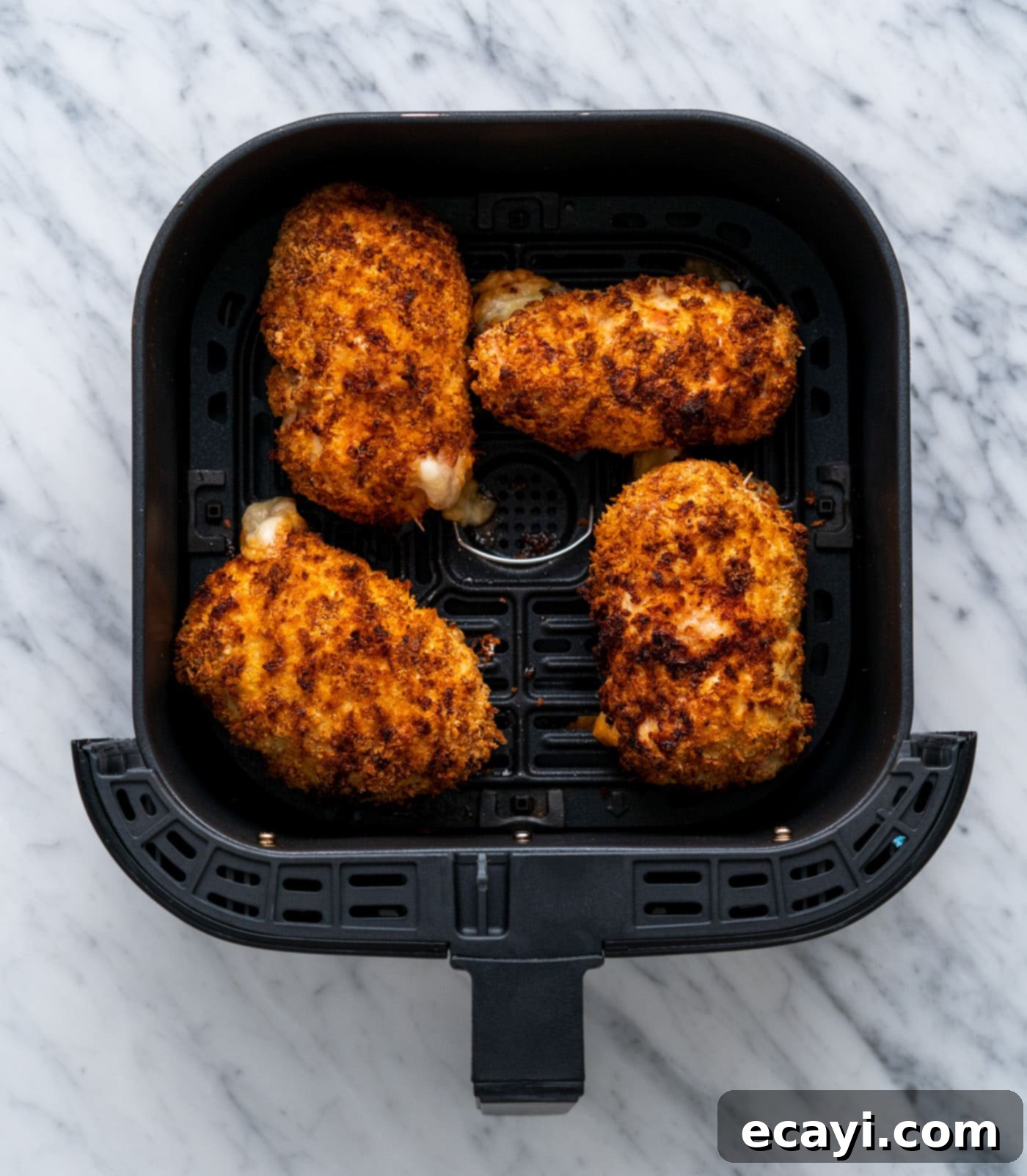 Crispy Air Fryer Chicken Cordon Bleu 16 Freshly cooked air fryer chicken cordon bleu on a plate, garnished with parsley