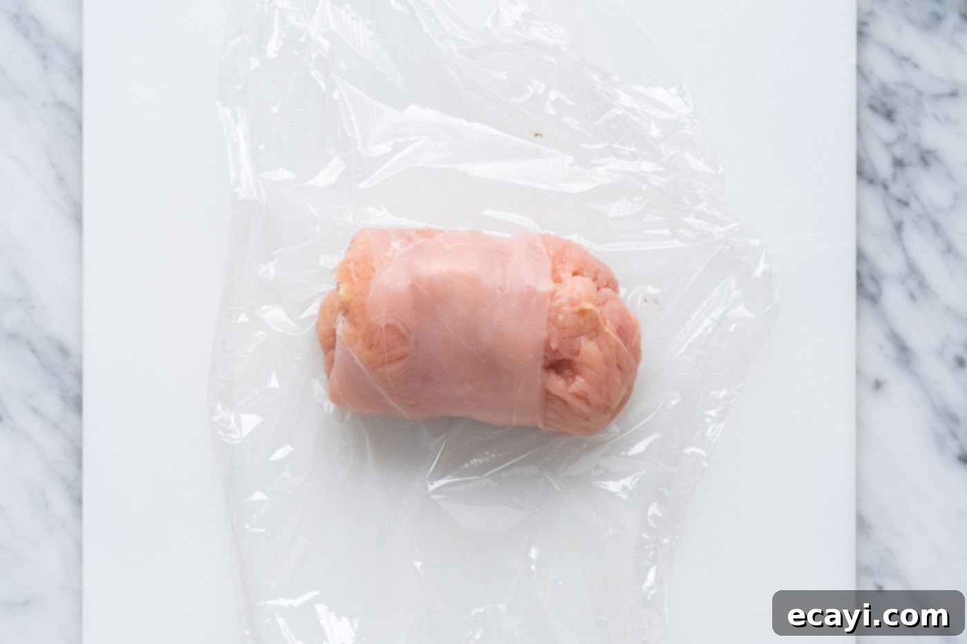 Crispy Air Fryer Chicken Cordon Bleu 8 Rolling chicken cordon bleu tightly with plastic wrap to secure the filling